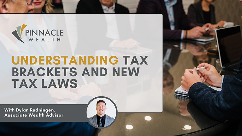 Financial advisors meeting around a conference table reviewing new tax laws and investment strategies